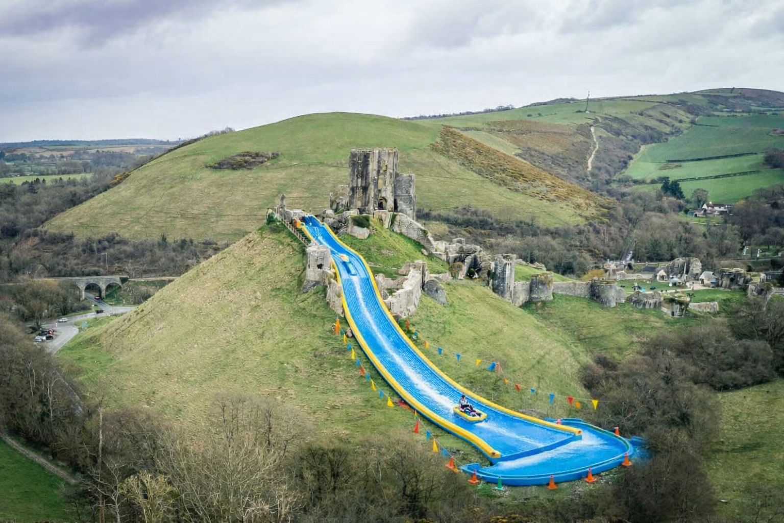 Corfe Castle Transforming Hill Into a Giant Slip and Slide