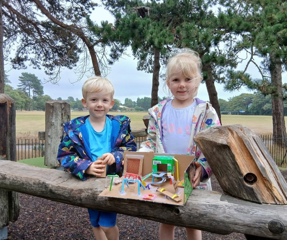 Plan for Play summer consultation - Two children with cardboard designs of play areas